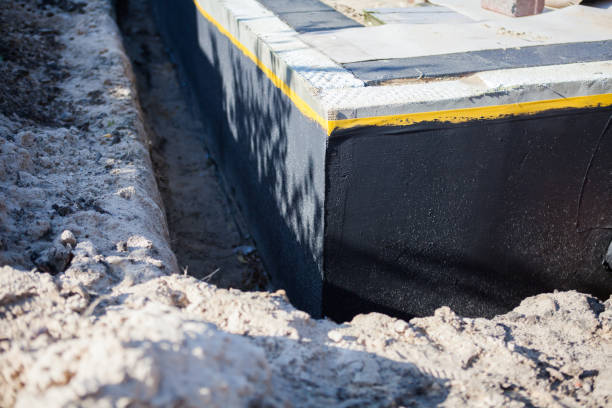 Professional Basement Waterproofing technician working in Austin, IN